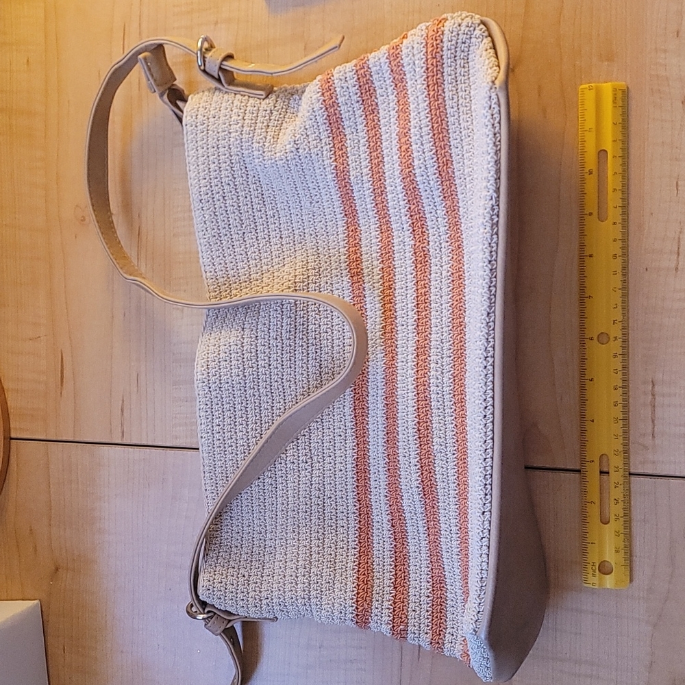 Medium sized tote bag with snap and zipper pockets.